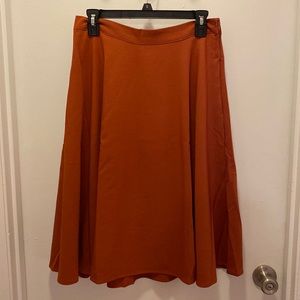 Orange ruse colored ModCloth “Just this sway a-line” skirt. Size M.